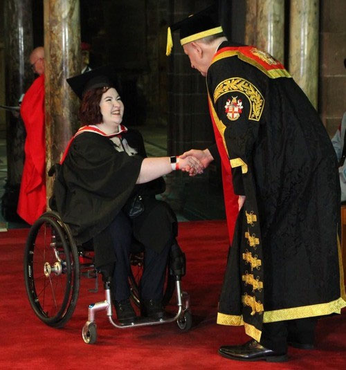 STaylor at graduation ceremony with university chancellor