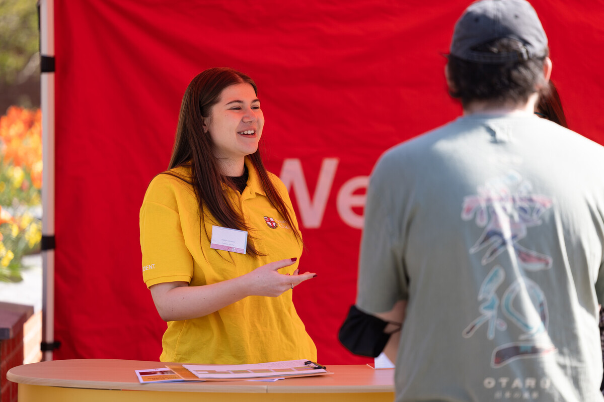 Student welcome perspective student with a smile