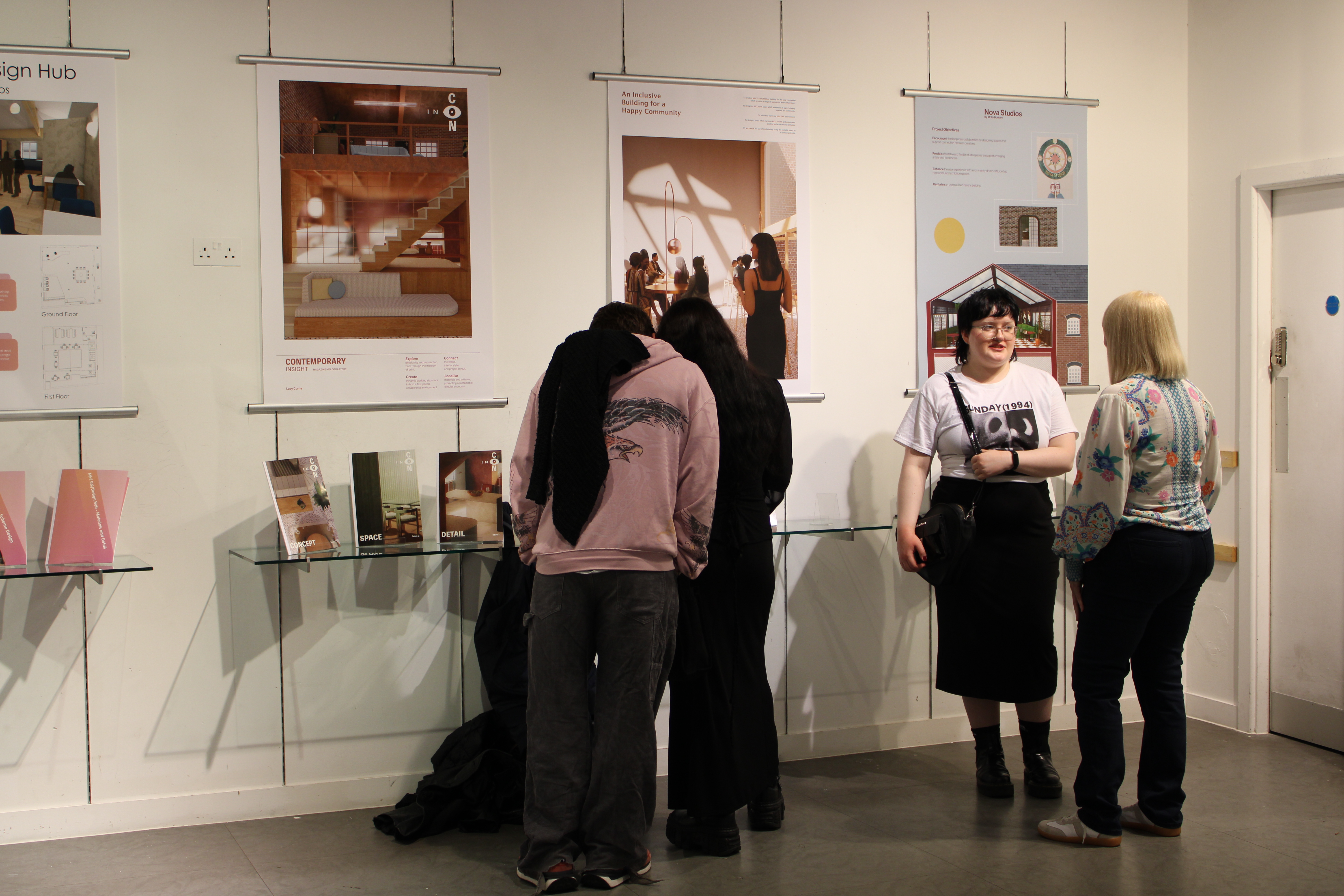 People looking at interior designs inside exhibition