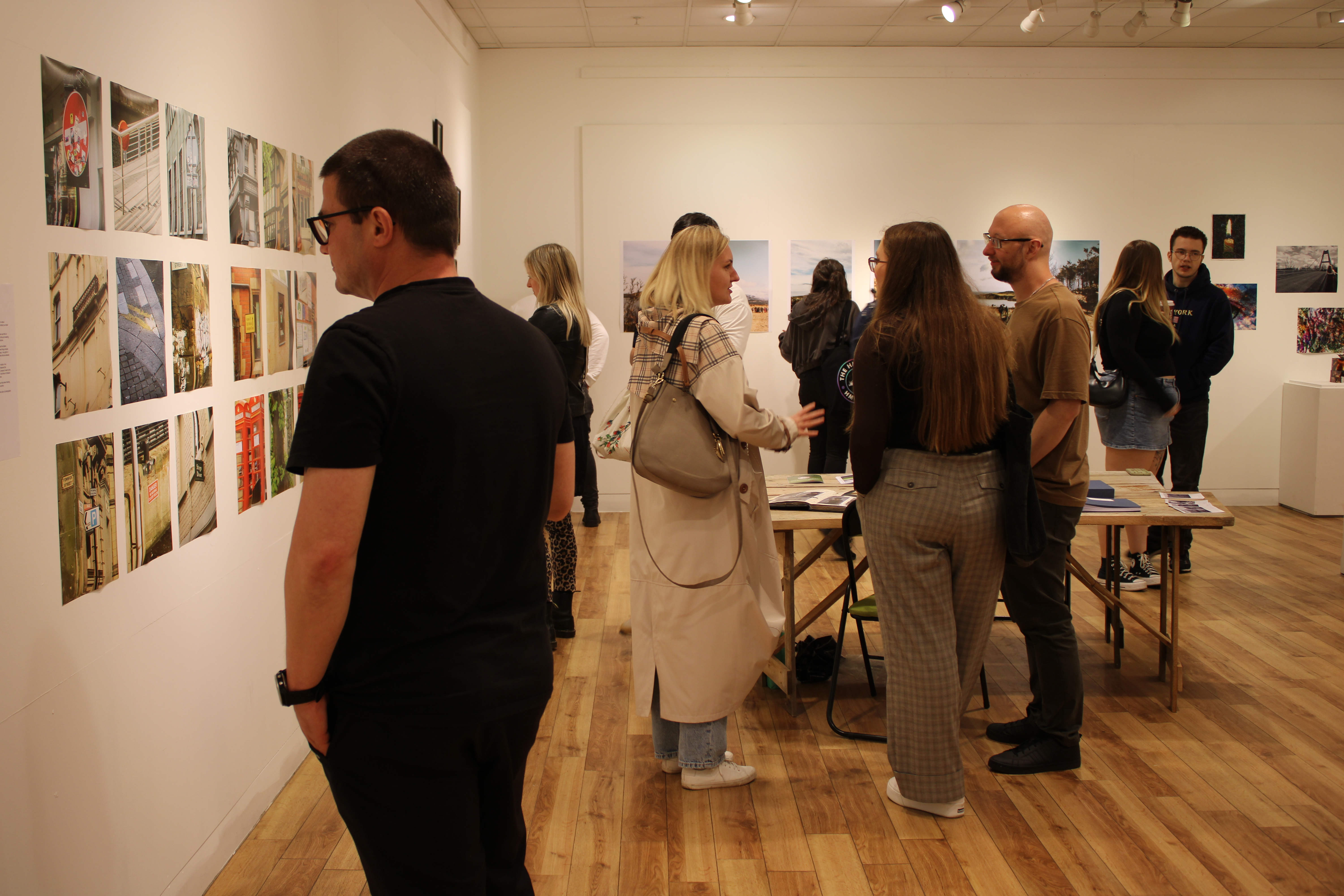 people looking at photographs