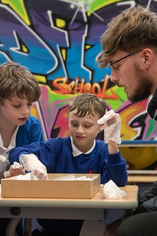 Early Childhood and Primary Education BA student leading a practical learning session with primary school pupils.