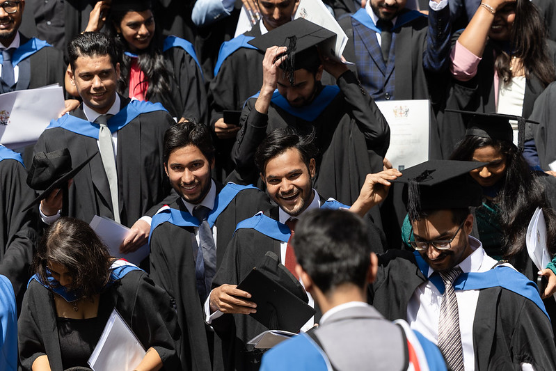 A group of students wearing graduation clothing