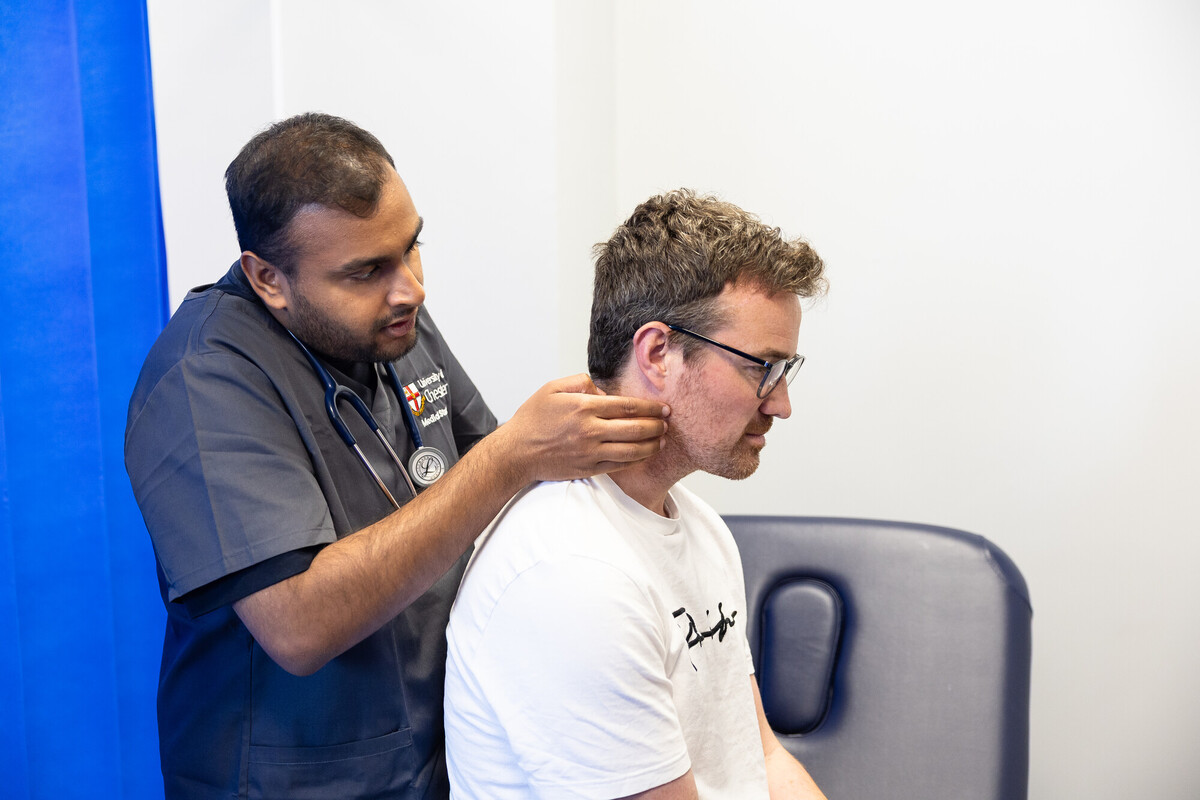 Graduate Medicine Student examines the lymph node around the neck