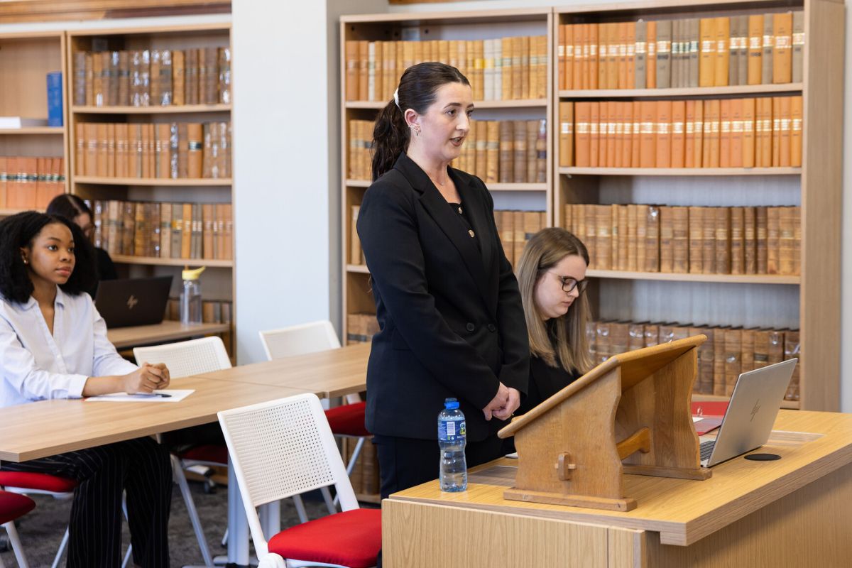 Students delivered their legal arguments in a formal court setting.