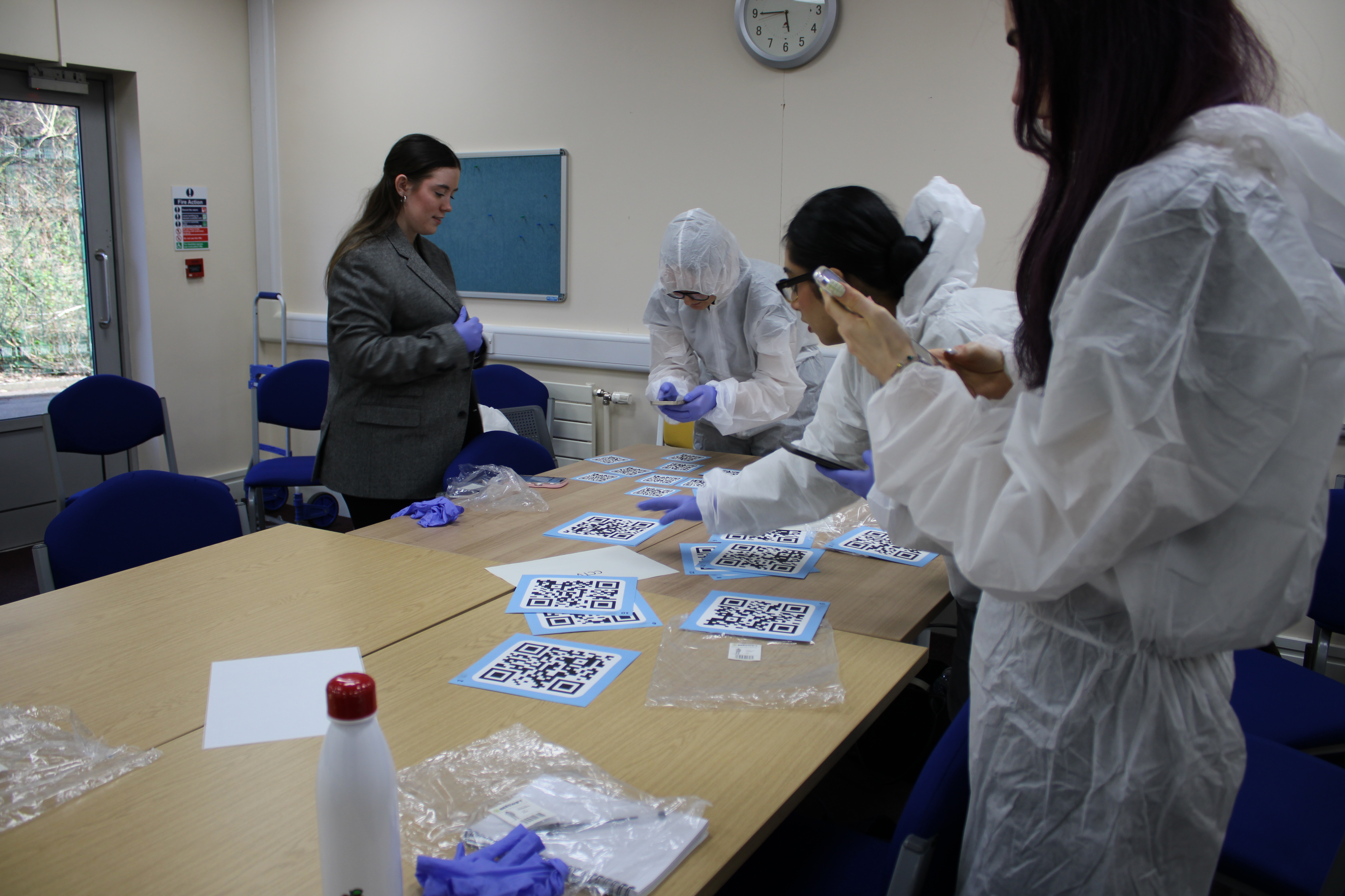 students looking at AR tags