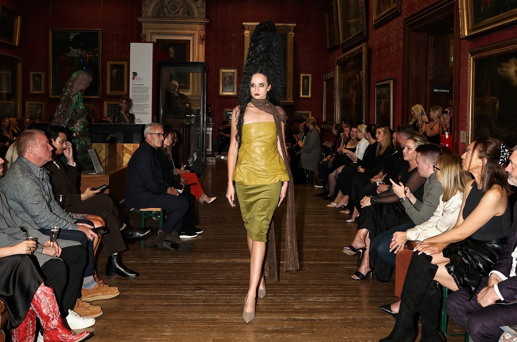 A model in an Alexandra Novacki design walking the runway at the Walker Gallery.
