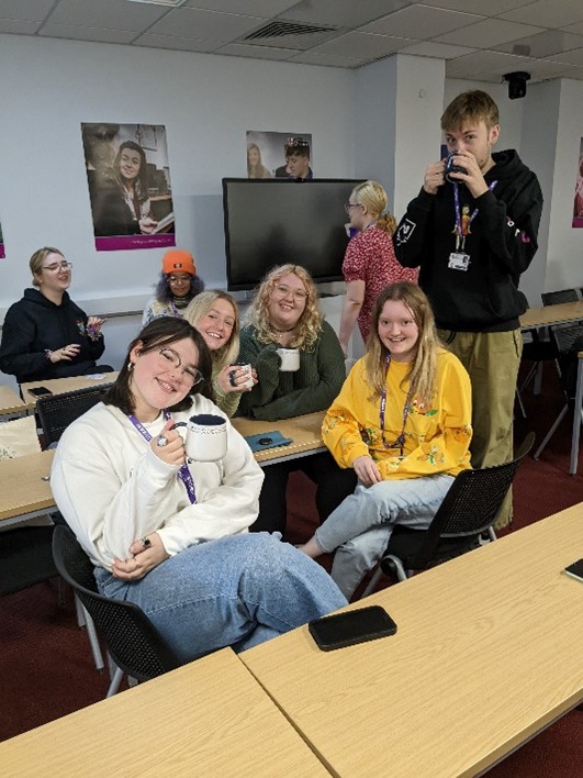 group of students having hot drinks
