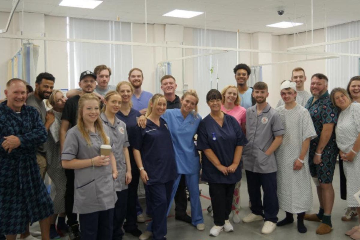 The cast and crew of Sutures at the University set.