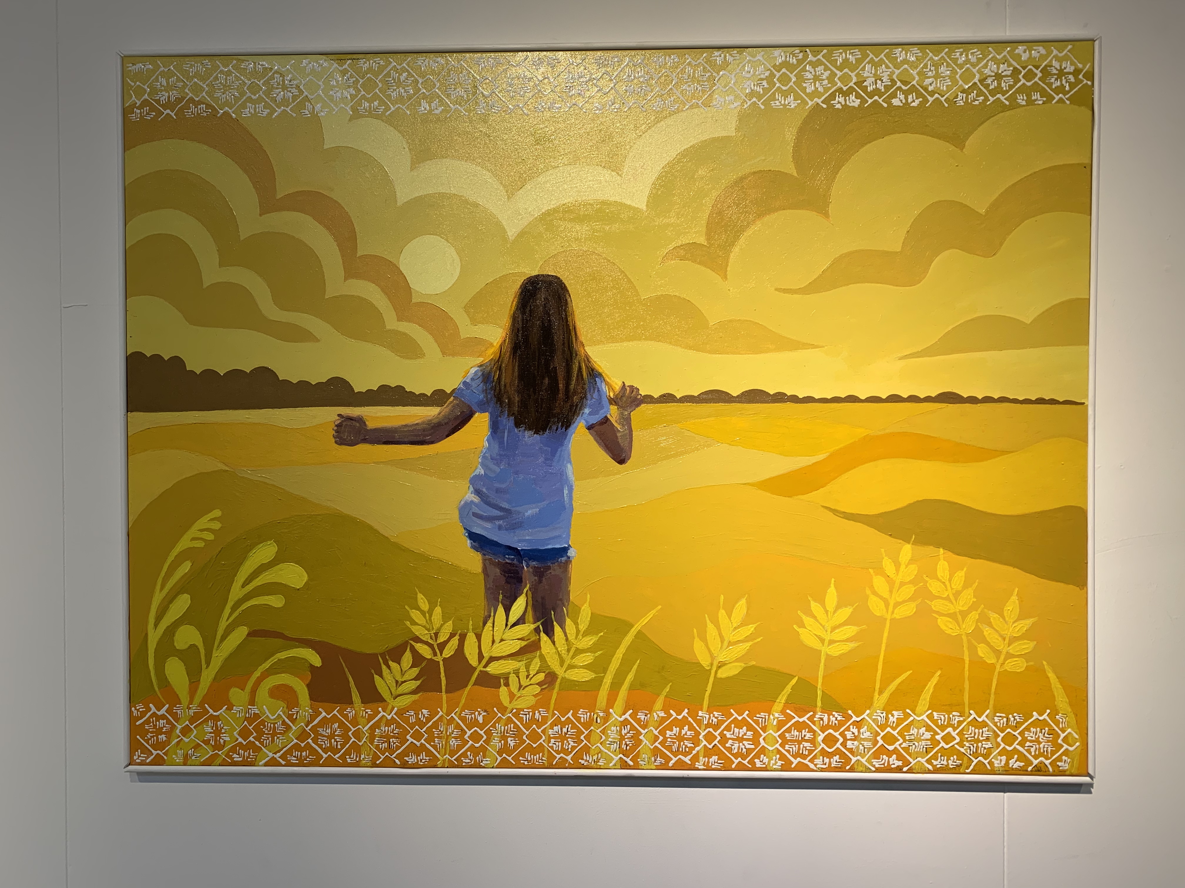 picture of a girl running through a wheat field