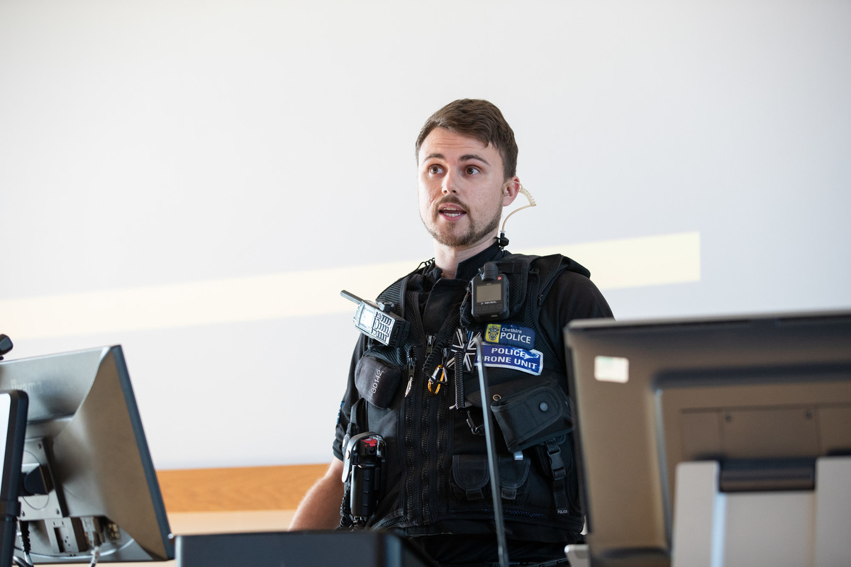 police officer in uniform in classroom