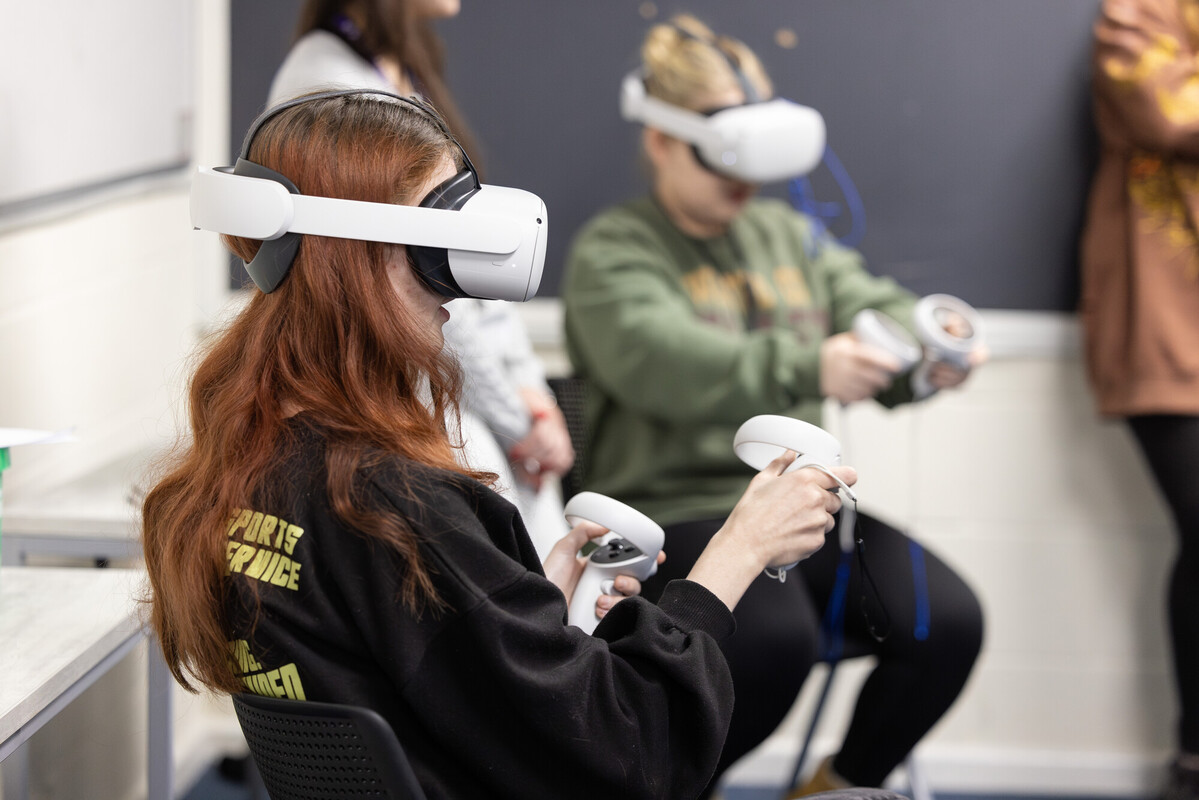 A psychology student wearing a VR headset