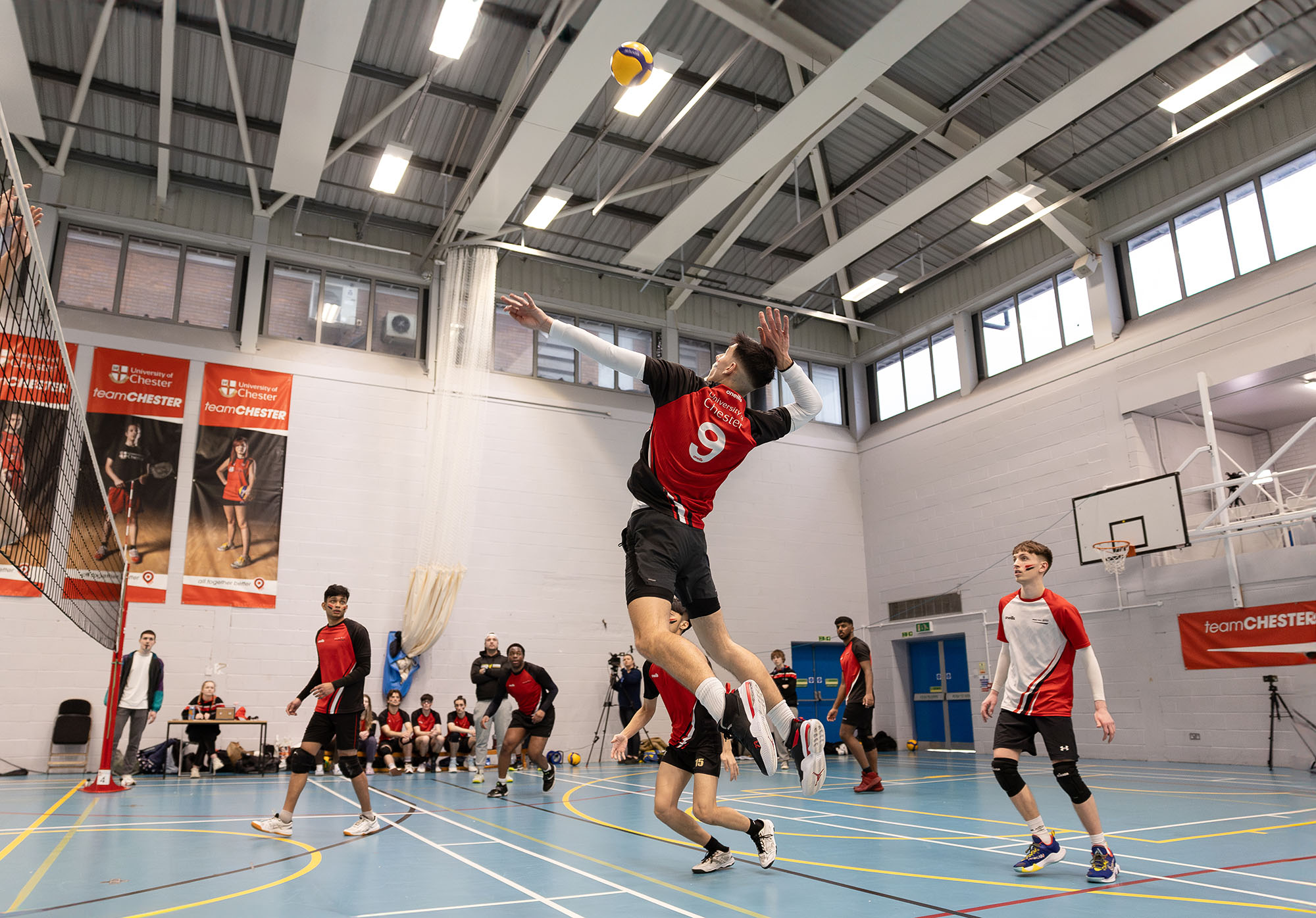 Student playing volleyball