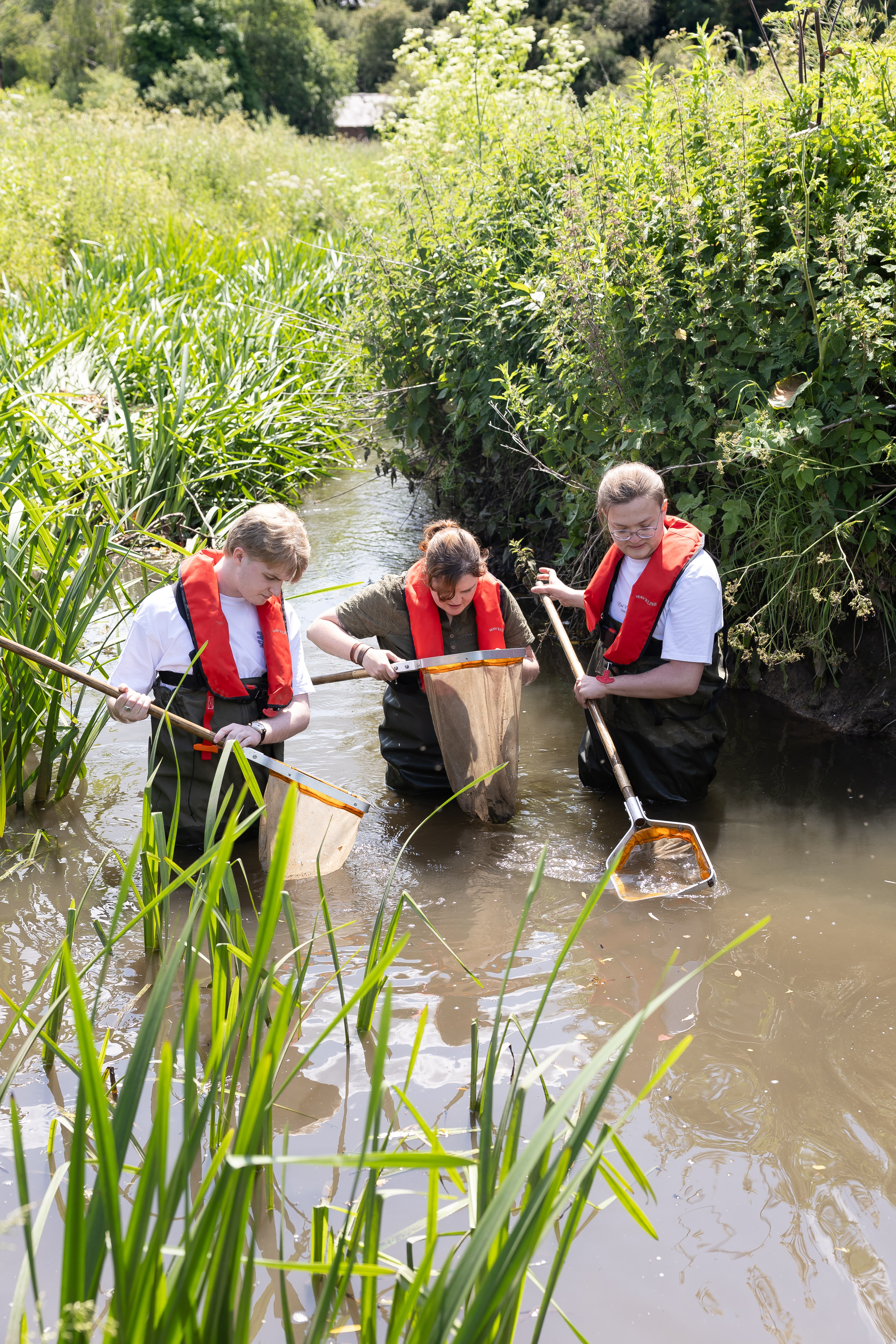 Zoology students in water