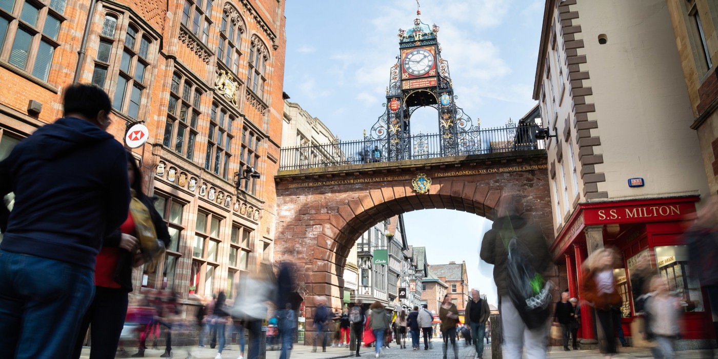 Looking up towards Chester's famous clock against a bright blue sky